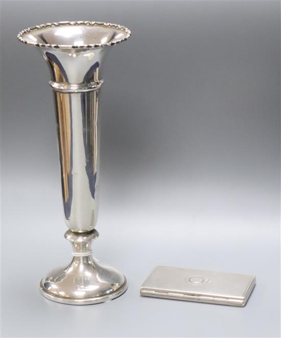 A Victorian engine turned silver card purse, G. Wheeler & Co, Birmingham, 1860, 83mm and a silver spill vase.